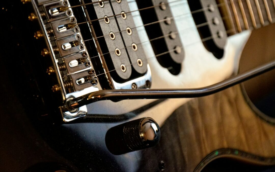 a close up of an electric guitar with a microphone